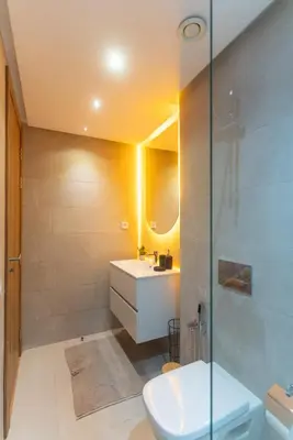 a bathroom with a toilet and a sink and a shower at AyaMi Marrakech Luxury Stay in Marrakech