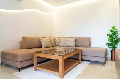 a living room with a couch and a coffee table at AyaMi Marrakech Luxury Stay in Marrakech