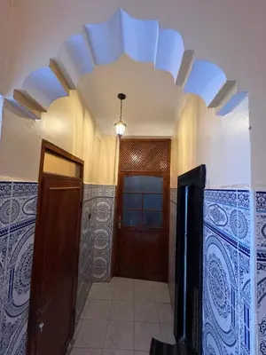a hallway with a door and a ceiling at Dar Adil à 5 min from Jemaa el fna médina in Marrakech