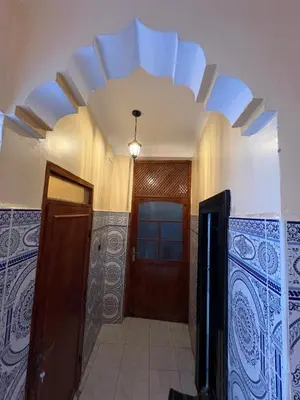 a hallway with a door and a ceiling at Dar Adil à 5 min from Jemaa el fna médina in Marrakech