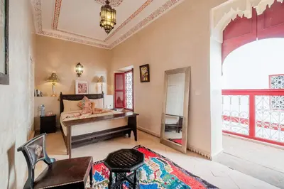 a bedroom with a bed and a piano in a room at Authentic Guesthouse Peral in the heart of Medina in Marrakech