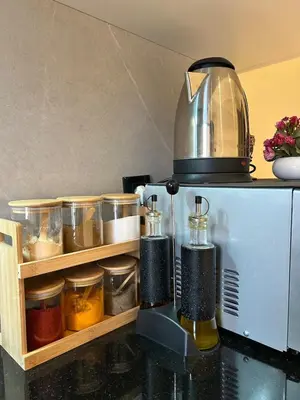a blender sitting on top of a counter with food at Appartement Moderne - Accès Piscines et Fitness in Marrakech