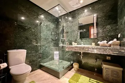 a bathroom with a shower and a toilet and a sink at 2 bedroom apartment in Plaza central Gueliz in Marrakech