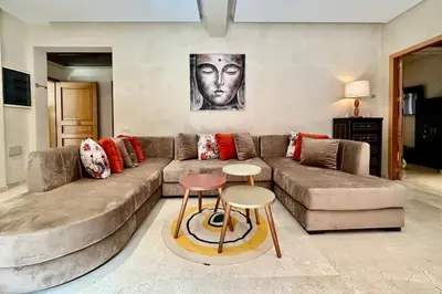 a living room with a couch and a table at 2 bedroom apartment in Plaza central Gueliz in Marrakech
