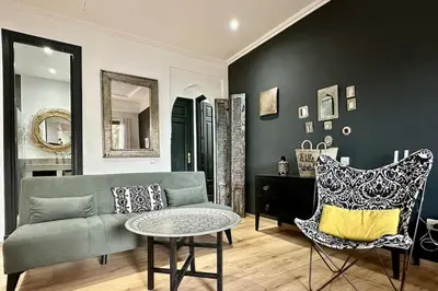 a living room with a couch and a table at Garden Aparment in Palmeraie 2 in Marrakech