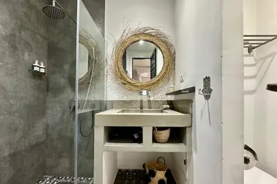 a bathroom with a sink and a mirror at Garden Aparment in Palmeraie 2 in Marrakech