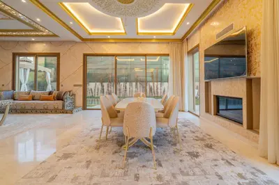 a dining room with a table and chairs at Luxury villa with heated pool and private Hammam in Marrakech