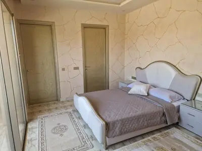 a bedroom with a large bed in a room at Luxury villa with heated pool and private Hammam in Marrakech