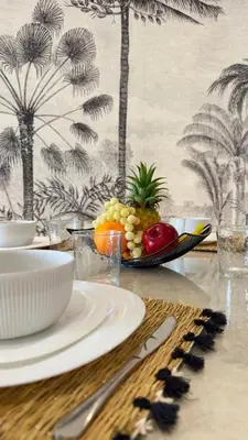 a table with a plate of fruit on it at New Appart cosy et raffiné avec piscine et Jacuzzi à Guéliz in Marrakech