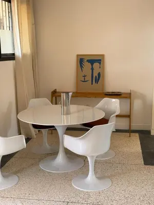 a white table and chairs in a room at Designer apartment with south-facing terrace in Marrakech