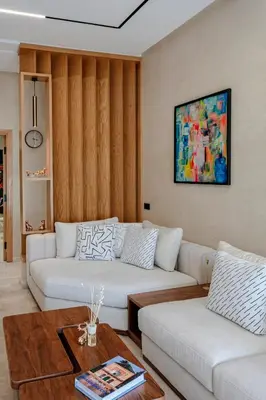 a living room with two white couches and a table at Villa Nerolia - Marrakech in Marrakech