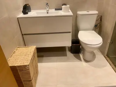 a bathroom with a toilet and a sink at prestigia urbane appartement marrakech in Marrakech