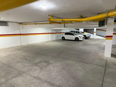a parking garage with two cars parked in it at Appartement Marrakech route de casa in Marrakech