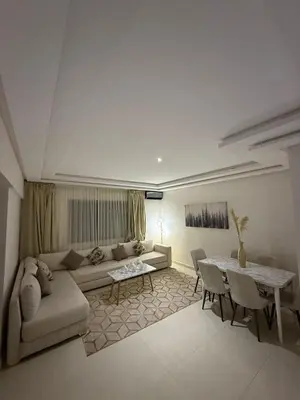 a living room with a couch and a table at Appartement Marrakech route de casa in Marrakech