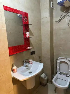 a bathroom with a sink and a toilet at Apartments city center in Marrakech