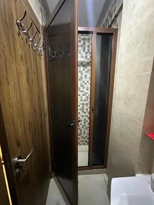 a bathroom with a shower and a toilet and a sink at Apartments city center in Marrakech