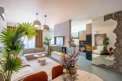 a living room with a couch and a table at Spacieux 2BR à Guéliz, Centre-Ville, Moderne et Confortable in Marrakech