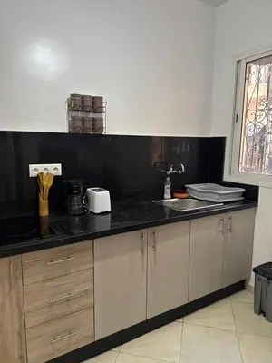 a kitchen with a sink and a counter top at Modern and quit appartment in Marrakech