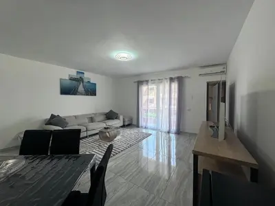 a living room with a couch and a table at Appartement Vacances FTS Little in Marrakech