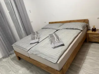 a bed with two pillows on it in a bedroom at Appartement Vacances FTS Little in Marrakech