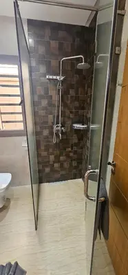 a shower with a glass door in a bathroom at Villa Akenza Marrakech in Marrakech