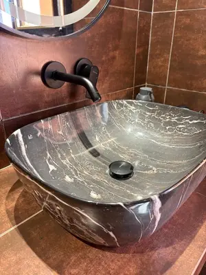 a glass sink in a bathroom with a faucet at Cozy Urban Haut Standing au cœur de Guéliz in Marrakech