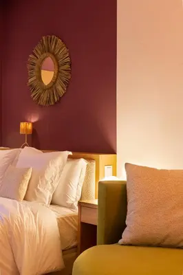 a bedroom with a bed and a mirror and a chair at Central 1BR Studio- AC & IpTV-Self check in- 2 guests in Marrakech