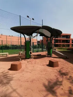 a batting cage in a park with a batting cage at Beautiful Apartment with Pool View Noria Golf in Marrakech