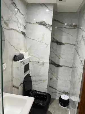 a bathroom with a toilet and a sink at Evasion à Marrakech very centrally located in Marrakech