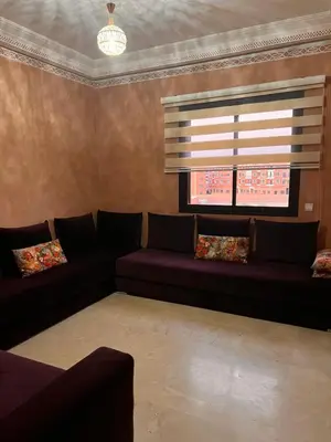 a living room with a couch and a window at App RIAD JAWHARA in Marrakech
