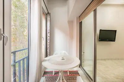 a white table in a room with a window at Cozy Nest balcony and bright in Marrakech