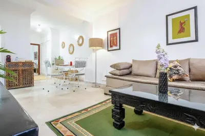 a living room with a couch and a table at Appartement de charme à Gueliz - Centre Marrakech in Marrakech