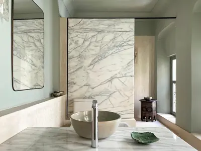 a bathroom with a large marble shower with a tub at Riad Dar Bou Seta - Small Riad in Marrakech