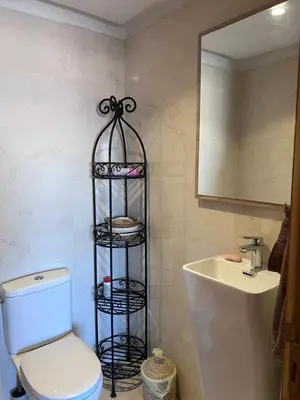 a bathroom with a white toilet and a sink at Azzizi in Marrakech