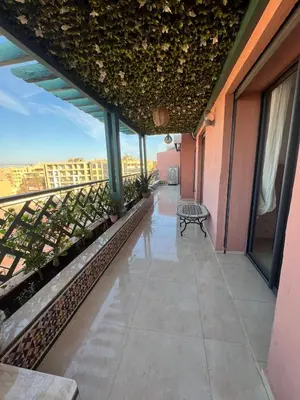 a balcony with a bench on a building at Azzizi in Marrakech