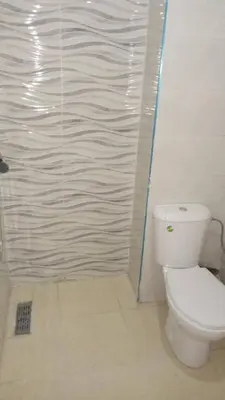a bathroom with a toilet and a shower at appartamento lalla Rita short-term rent in Marrakech