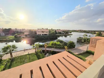 a view of the river from the balcony of a building at Penthouse Marrakech Village avec vue Panoramique sur le Lac in Marrakech