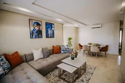 a living room with a couch and a table at Modern 3BR Luxury Prestigia Golf in Marrakech