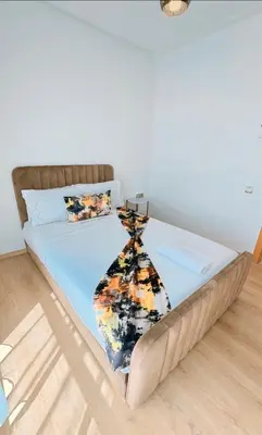 a bed in a room with a bedspread at Modern 3BR Luxury Prestigia Golf in Marrakech