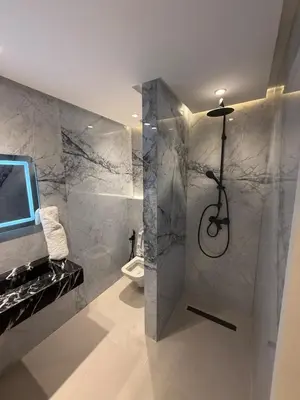 a bathroom with a shower and a toilet at Modern Apartment in Jnane Gueliz in Marrakech