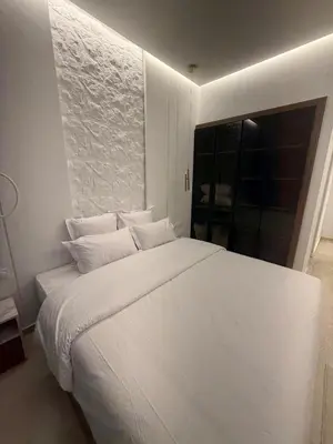 a large white bed in a room with a window at Modern Apartment in Jnane Gueliz in Marrakech