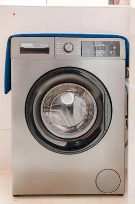 a washer and dryer sitting in a room at Cozy Mykonos 2BR Apartment in Marrakech