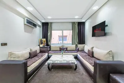 a living room with a couch and a table at Cocon Urbain centre-ville et confort in Marrakech