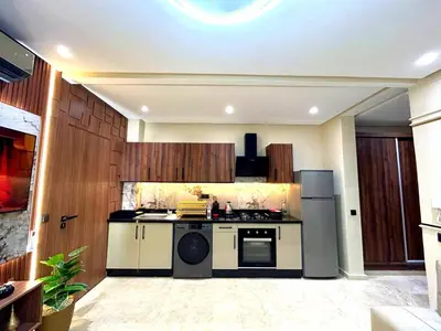 a kitchen with a stove and a refrigerator at Central Victor Hugo Studio near Gueliz Wi-Fi in Marrakech