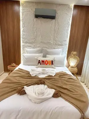 a bedroom with a bed with a mom sign on it at Central Victor Hugo Studio near Gueliz Wi-Fi in Marrakech