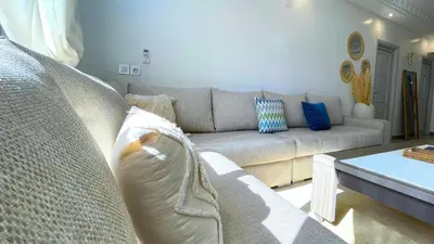 a living room with a couch and a table at Très belle appartement à Gueliz in Marrakech