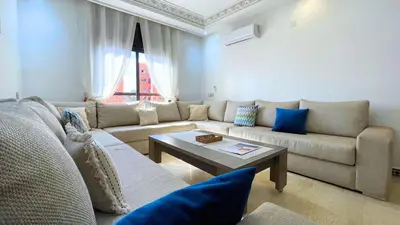 a living room with a couch and a coffee table at Très belle appartement à Gueliz in Marrakech