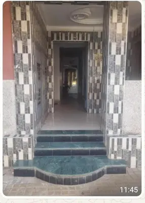 a hallway with stairs in a building at Casa della calma in Marrakech