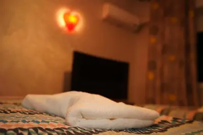 a white towel sitting on top of a table at Superbe Appartement 3 pieces à Majorelle in Marrakech