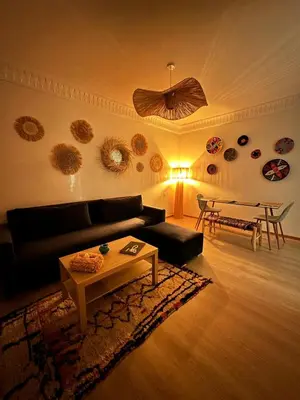 a living room with a couch and a table at Serenity Loft in Marrakech